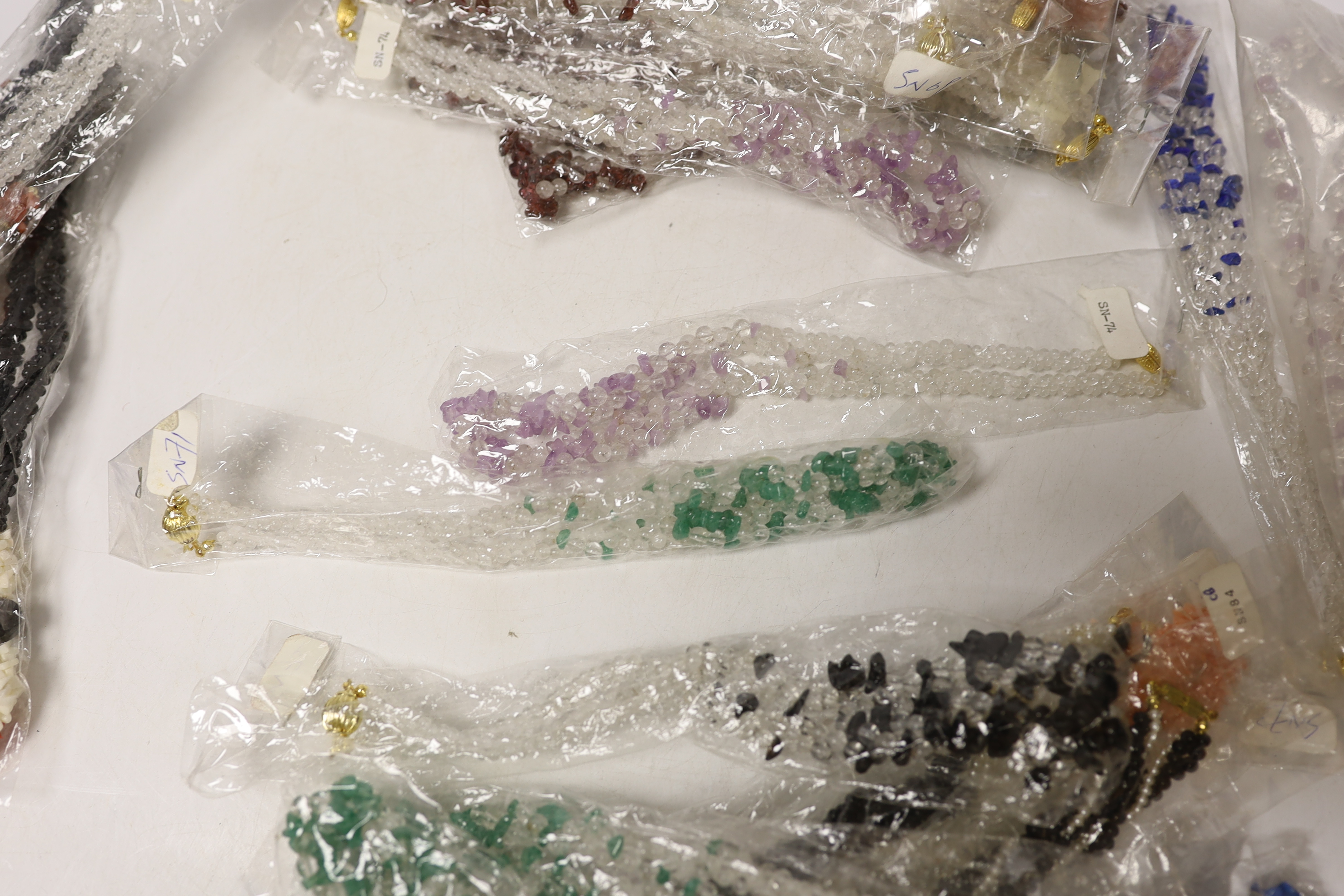 Approximately thirty assorted modern bead necklaces.